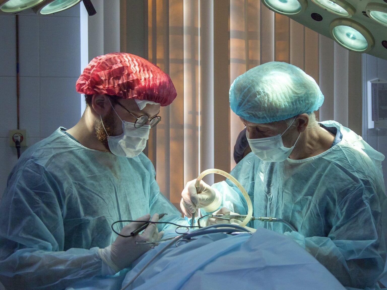 Surgeons performing surgery